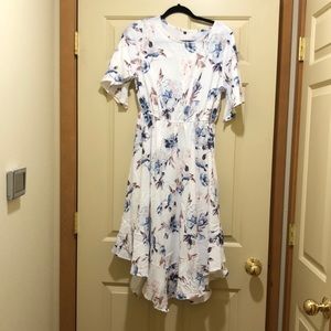 Floral dress. Hem ruffled  longer in front. Never worn.
